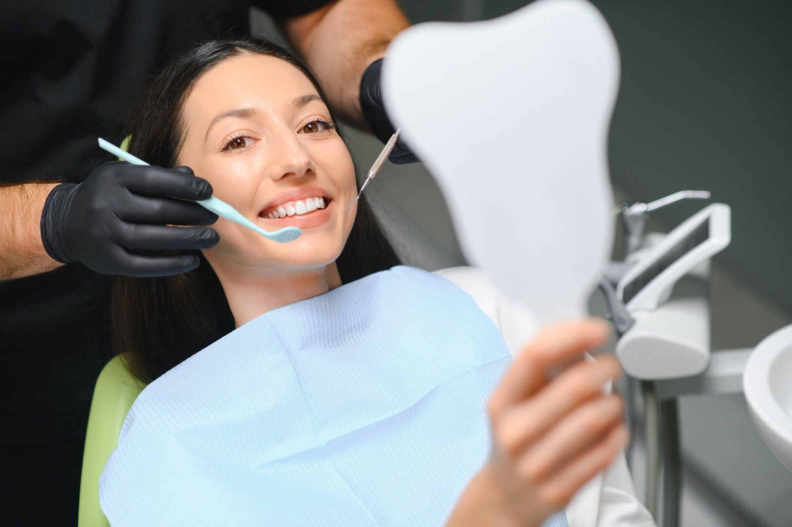 Doctor examining patient's teeth, closeup. Cosmetic dentistry