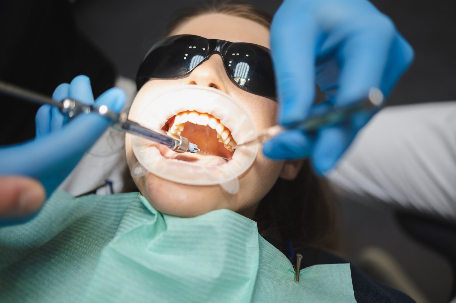 Doctor giving anesthesia to the patient before dental surgery