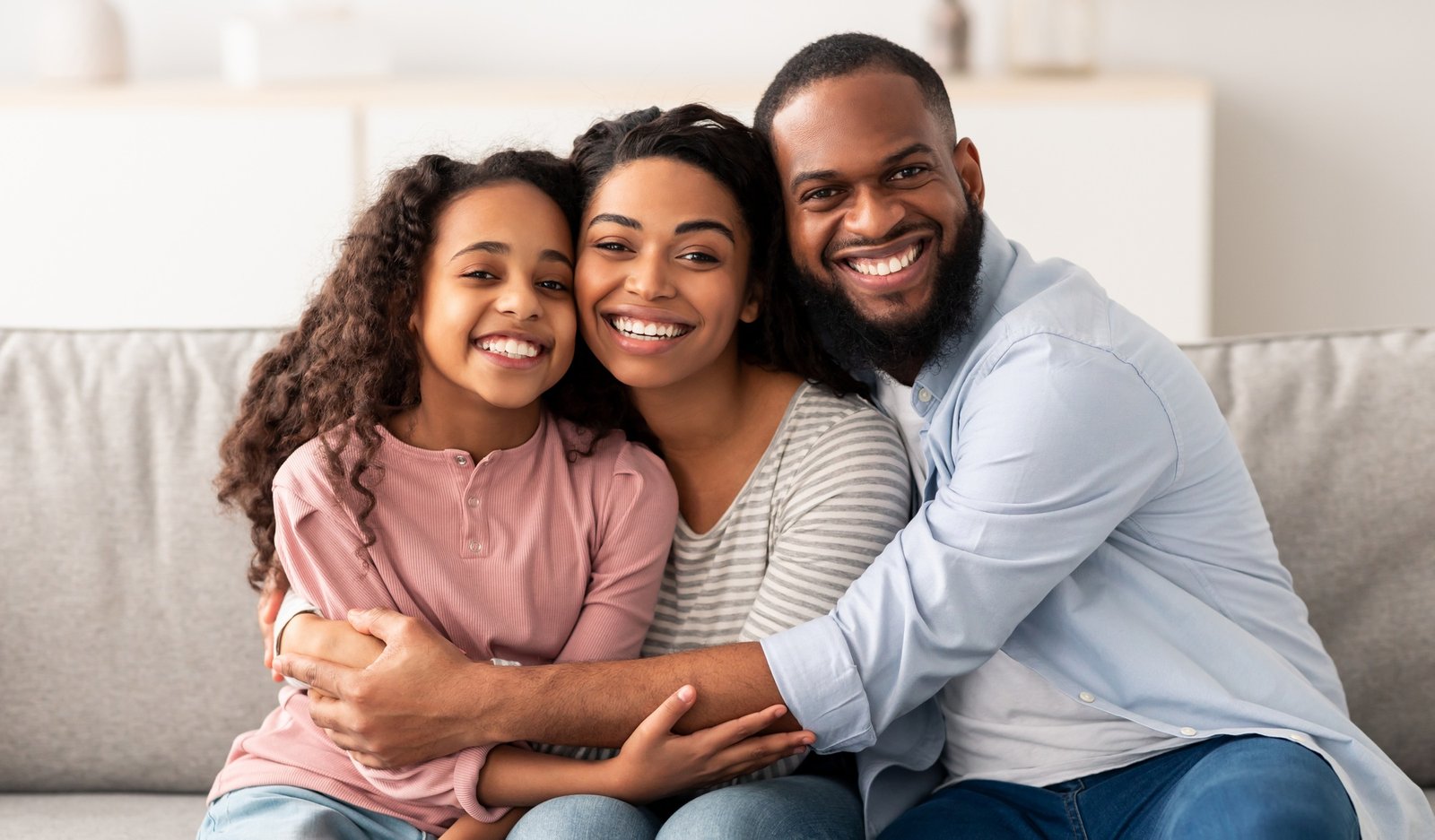 Portrait of a happy black family smiling at home